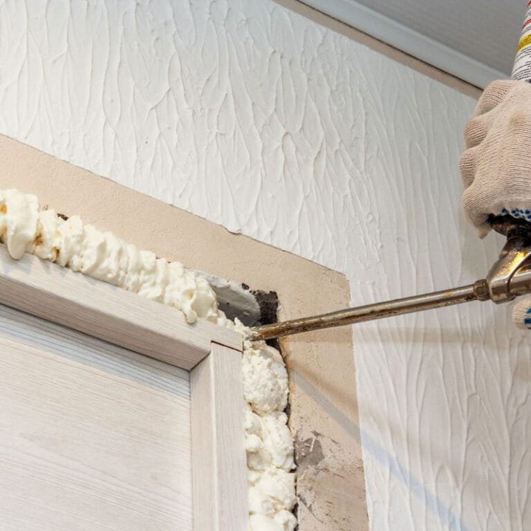 Topsen A1 PU foam being applied to fill gaps in a wall, providing insulation and airtight sealing